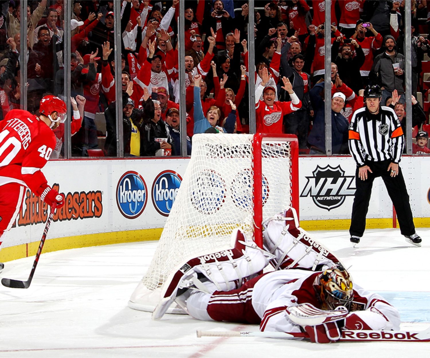 DETROIT, MI - JANUARY 12: Henrik Zetterberg #40 of the Detroit Red Wings scores the game winning goal in a shootout on Mike Smith #41 of the Phoenix Coyotes during an NHL game at Joe Louis Arena on January 12, 2012 in Detroit, Michigan. Wings win 3-2 in shootout. (Photo by Dave Reginek/NHLI via Getty Images)