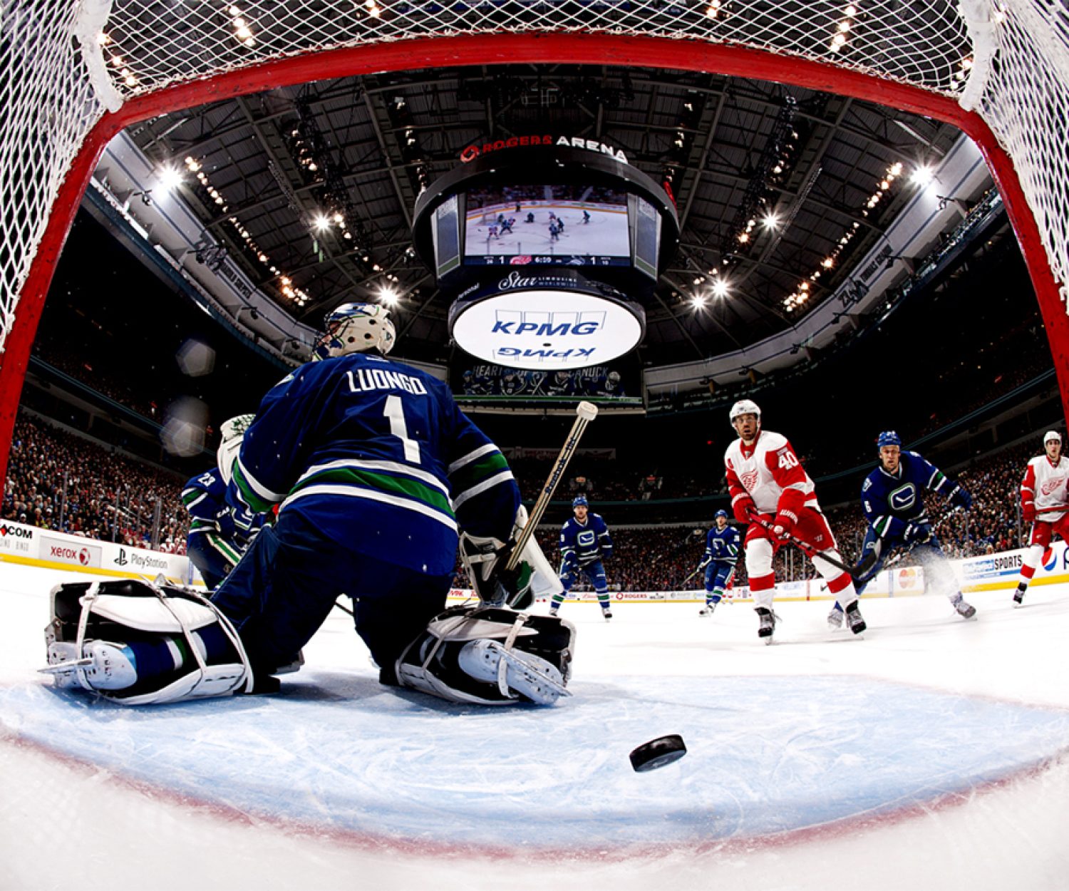 VANCOUVER, CANADA - FEBRUARY 2: Henrik Zetterberg #40 of the Detroit Red Wings watches the puck go behind Roberto Luongo #1 of the Vancouver Canucks during their NHL game at Rogers Arena February 2, 2012 in Vancouver, British Columbia, Canada. (Photo by Jeff Vinnick/NHLI via Getty Images)