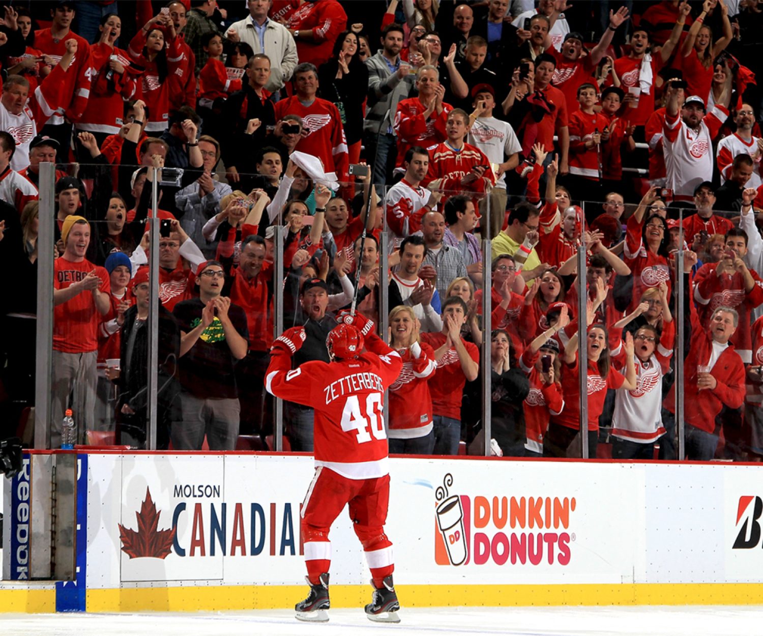 DETROIT, MI - MAY 10: Henrik Zetterberg #40 of the Detroit Red Wings pumps his hands to the home town crowd after being named the first star of the game after Game Six of the Western Conference Quarterfinals against the Anaheim Ducks during the 2013 NHL Stanley Cup Playoffs at Joe Louis Arena on May 10, 2013 in Detroit, Michigan. Detroit defeated Anaheim 4-3 in overtime (Photo by Dave Reginek/NHLI via Getty Images)